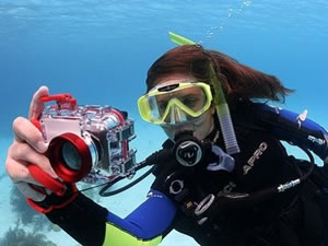 diver taking a photo underwater