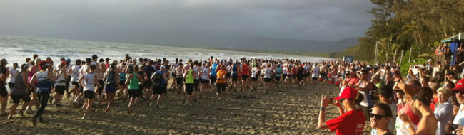 Half Marathon runners take off along Four Mile Beach in Port Douglas, as part of the 2013 CANEGROWERS Great Barrier Reef Marathon Festival.