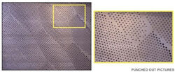 An enlarged section of a perforated metal image.