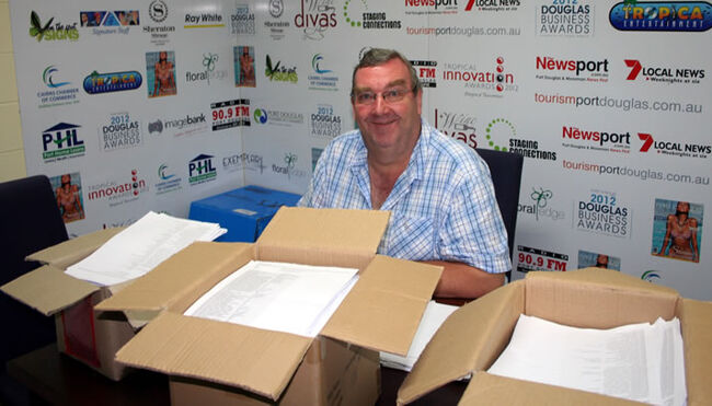 Newsport Media Publishing's Roy Weavers counts the votes.