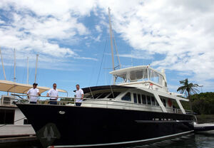 (L-R)  Blue Martini's skipper, Russell Player, with FNSF Directors Tony Fyfe and Craig Parsell aboard Blue Martini. PIC EMMA GROVES