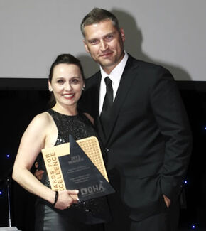 Sheraton Mirage Port Douglas’ Elena Fragasso accepts the QHA award for Lagoons Restaurant in Brisbane.